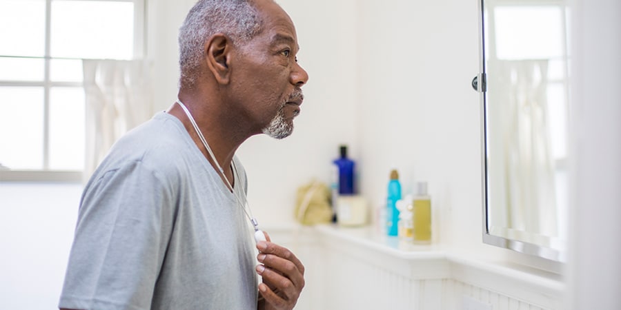 Senior looking at a mirror