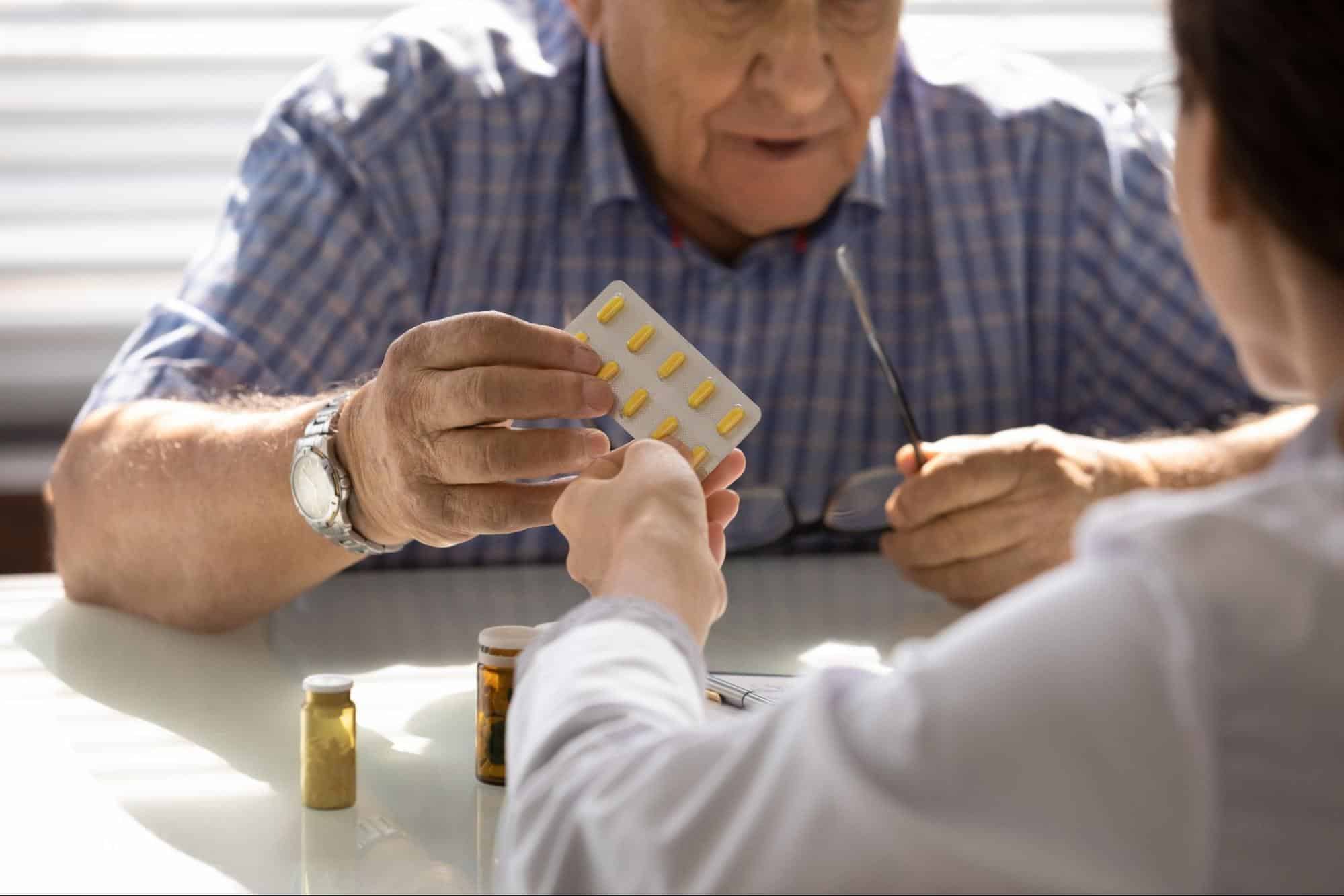 Doctor giving medication to patient