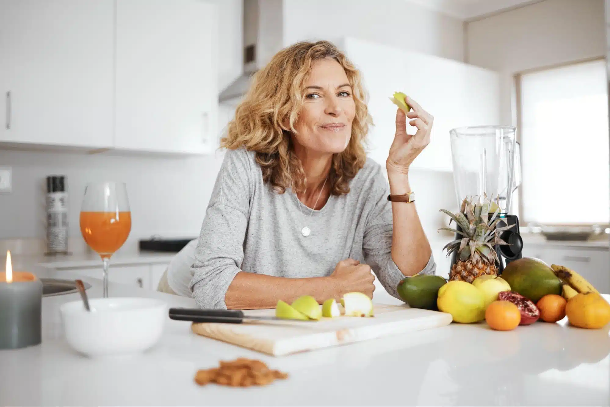 a woman eating fruit