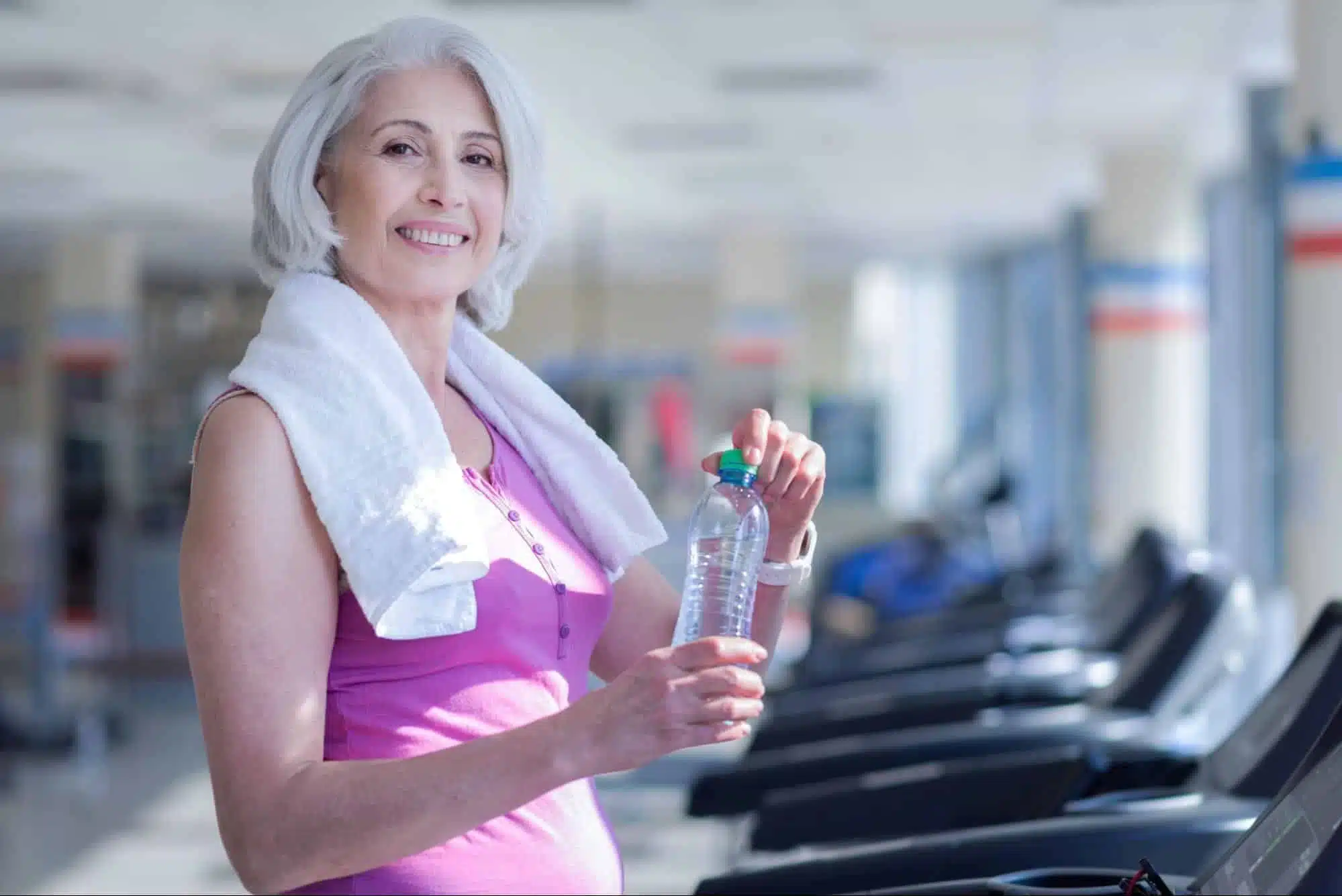 a woman standing on a treadmil