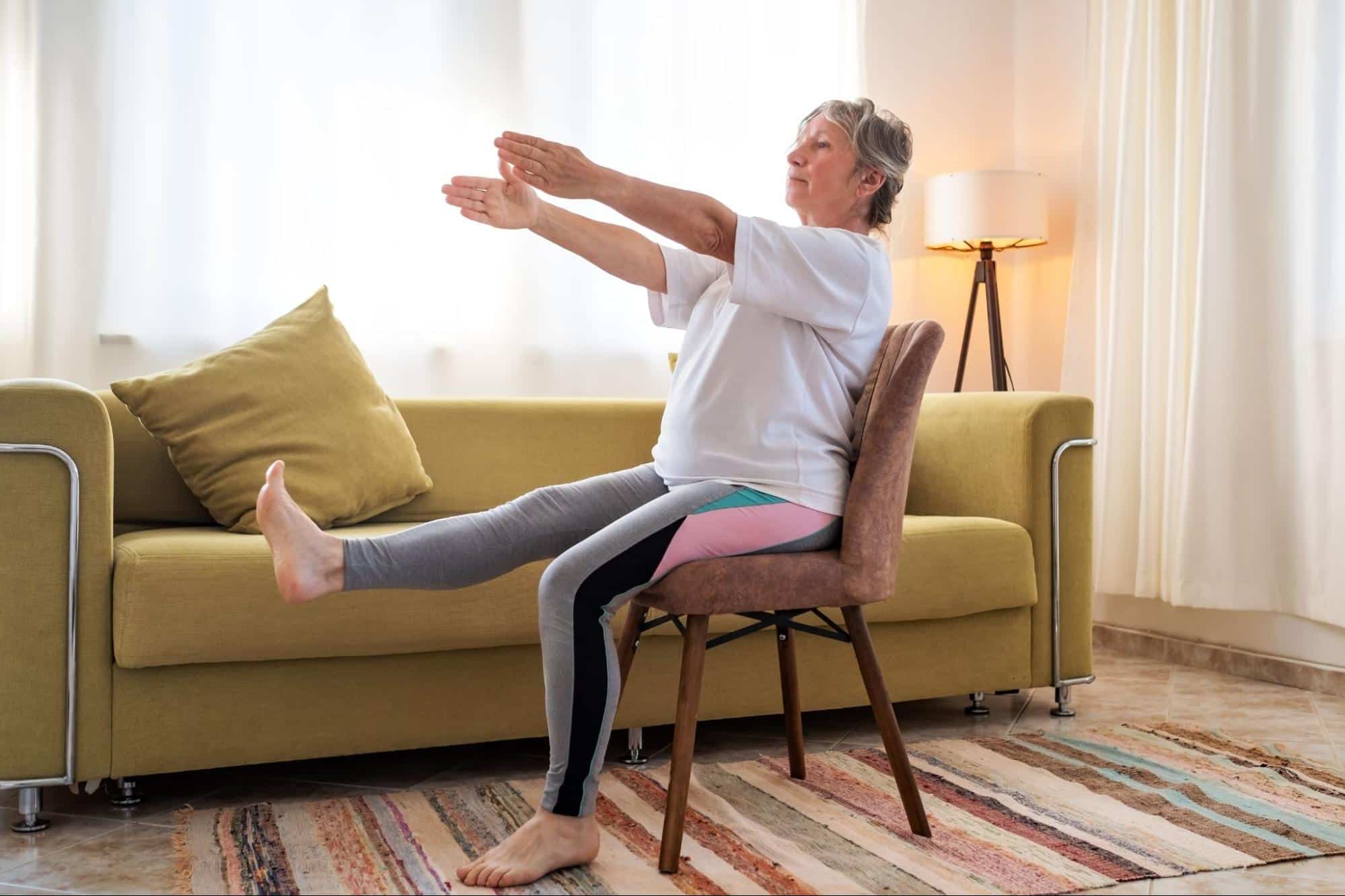 Seniors exercising while sitting down