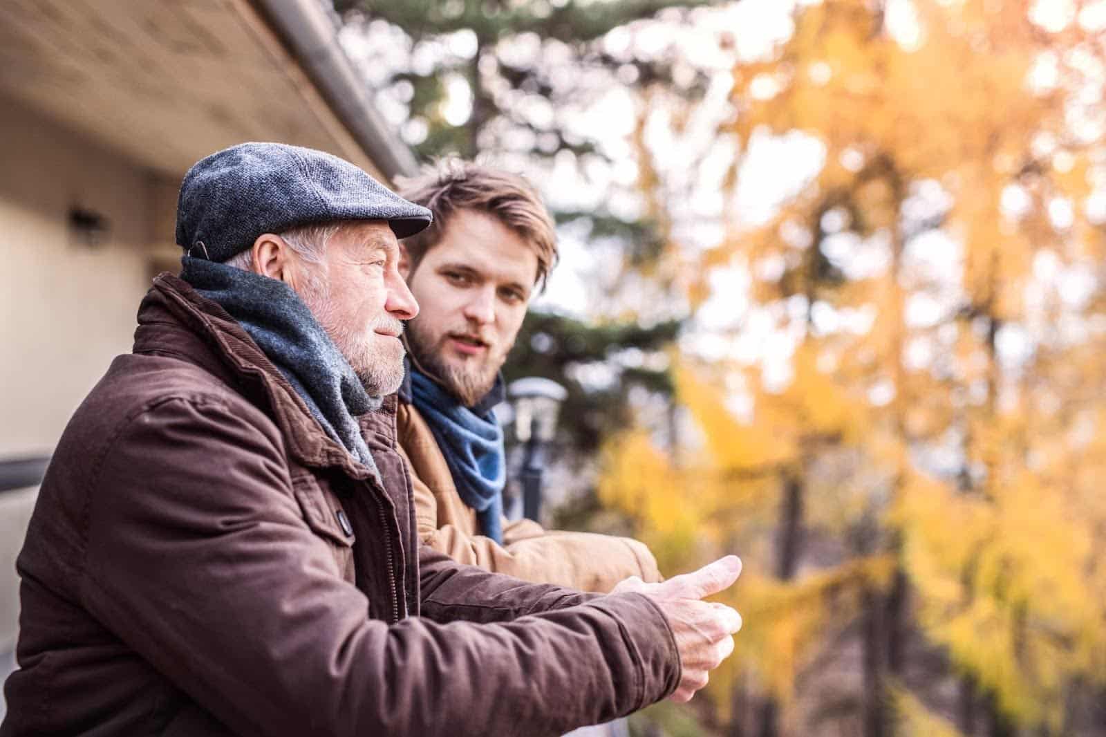 Father and son outside talking