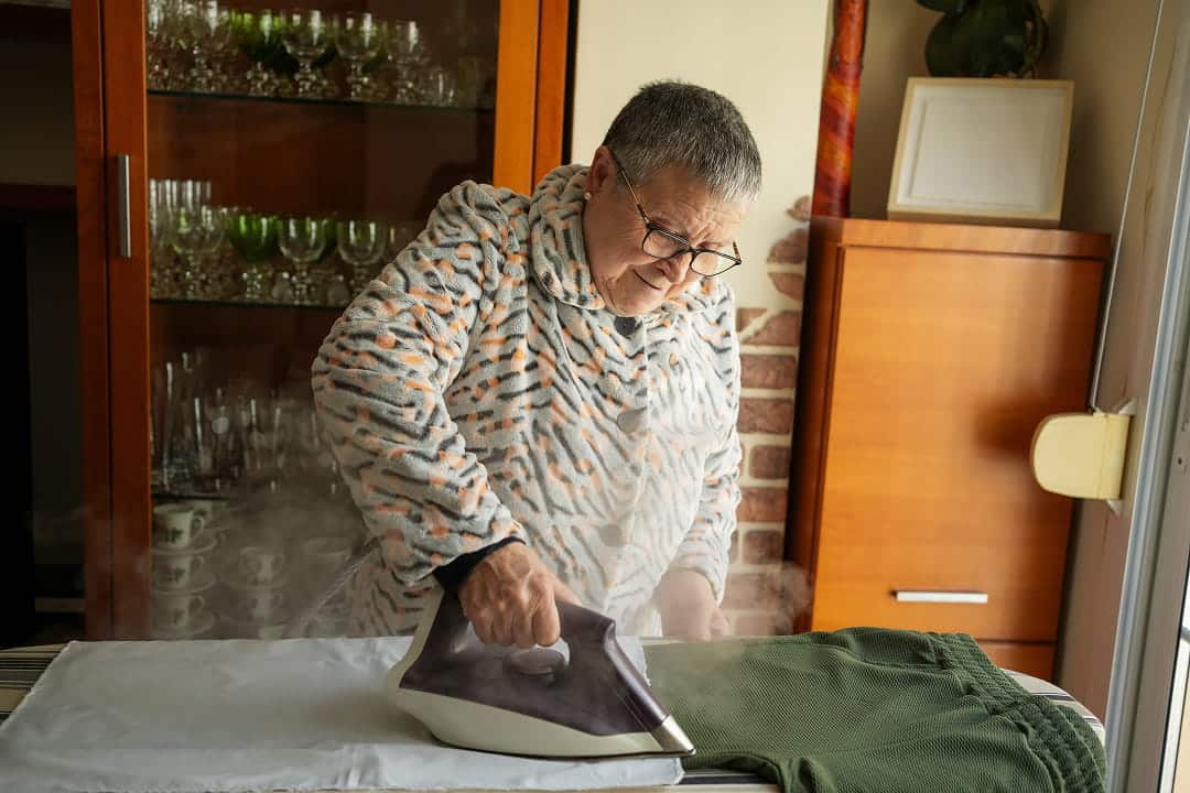 Senior ironing pants