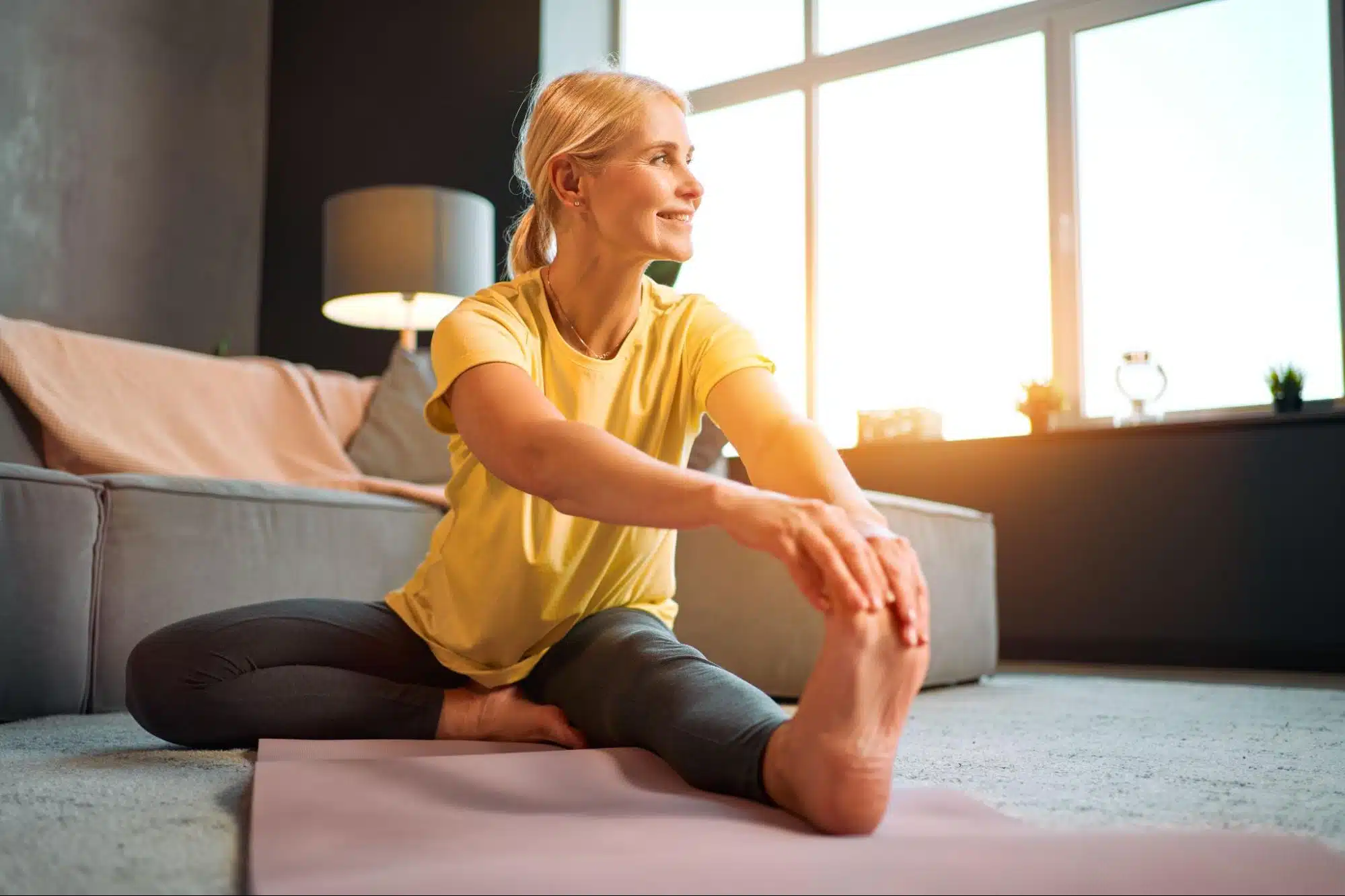 A woman stretching her left leg.